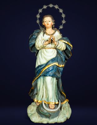 a statue of a woman with a crown of stars on her head