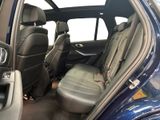 the interior of a car with the door open and the seats down