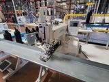 a machine that is working on a piece of metal