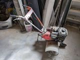 a small machine that is sitting in the garage
