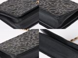 two photos of a black purse with a chain attached to it