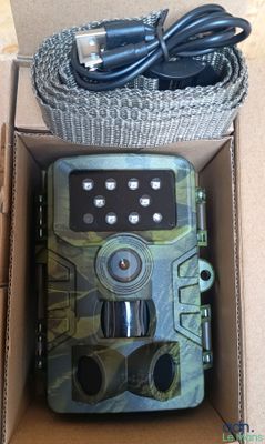 a box with a camera and a charger inside of it
