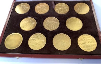 an image of a box of gold coins on a white surface