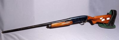 a toy gun that is sitting on a white surface