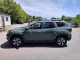 a picture of a green suv parked in a parking lot