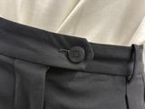 a close up of a person ' s pants with a button on it