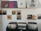 a room with a lot of records on the wall