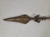 an image of a metal object with a bird on top of it