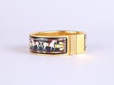 an image of a gold ring with horses and horses on it