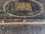 a close up of a metal box with a clock on it