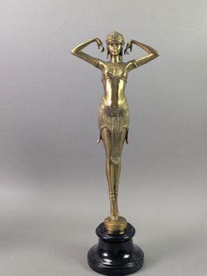 an image of a statue of a woman holding her hands on her head