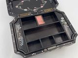 a small black box with a floral design on it