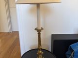 a lamp that is sitting on a table next to a couch