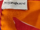an orange shirt with a red and white design on it