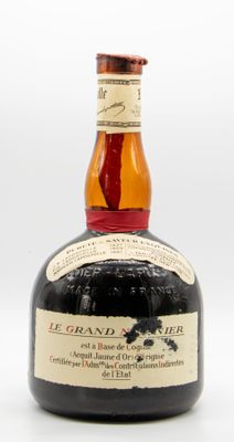 an image of a bottle of brandy sitting on a white surface