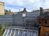 a lot of junk in the yard of a house
