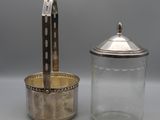 an antique silver plated glass jar and a silver plated glass jar