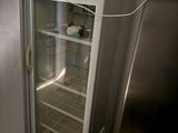 a refrigerator that has a door open in a kitchen