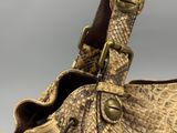 an image of a close up of a handbag with a giraffe on it