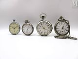 several different types of pocket watches are displayed on a white surface