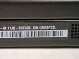 a close up of a laptop with a barcode on it