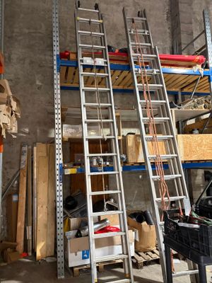 a ladder that is leaning against a wall in a garage