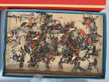 two boxes that have a bunch of toy soldiers in them