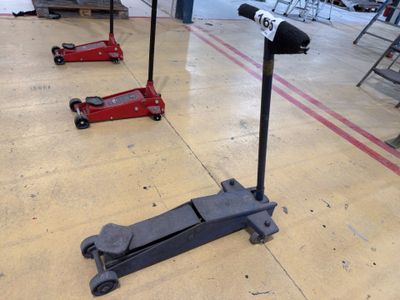 three jacks sitting on the floor in a warehouse