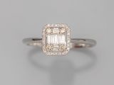 an emerald and diamond ring