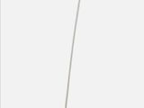 a white lamp that is on a white table