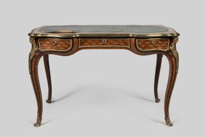 a small desk with a marble top and two drawers