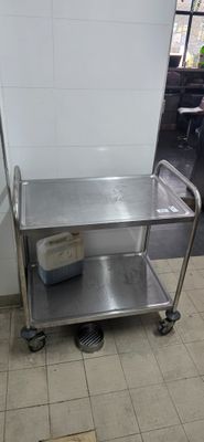 a stainless steel utility cart with a bucket on it