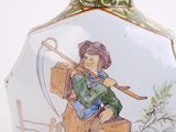 a vase with a picture of a man on it