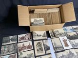 a box full of old postcards sitting on a table