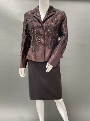 an image of a mannequin wearing a brown jacket and skirt