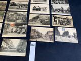 several old black and white photographs of people and buildings on a table