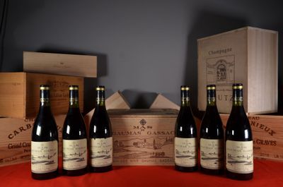 several bottles of wine are lined up on a table