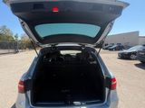 the back end of a car with its trunk open in a parking lot