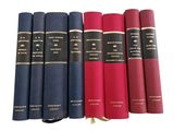 six books in a row on a white surface with a white background