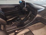 a picture of a car interior with a steering wheel