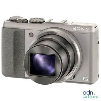 the camera is sitting on a white surface with a white background