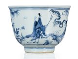 a blue and white bowl with a woman in a landscape