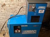 a blue machine that is sitting in a room