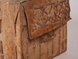 an old wooden box with a handle on it