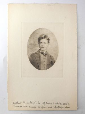 an old photo of a young man in a suit and bow tie