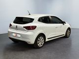 the rear end of a white car parked in a room