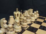 a chess board with a lot of chess pieces on it