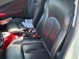 the interior of a car with black leather seats and a steering wheel