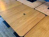 a lot of tables that are lined up on the floor