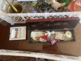 a table with various items on it and a basket of stuff on top of it